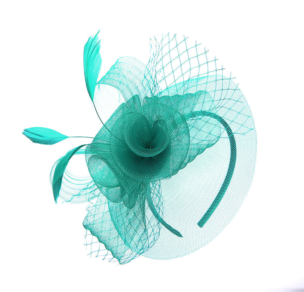 green floral fascinator with feathers and net mounted on an alice band