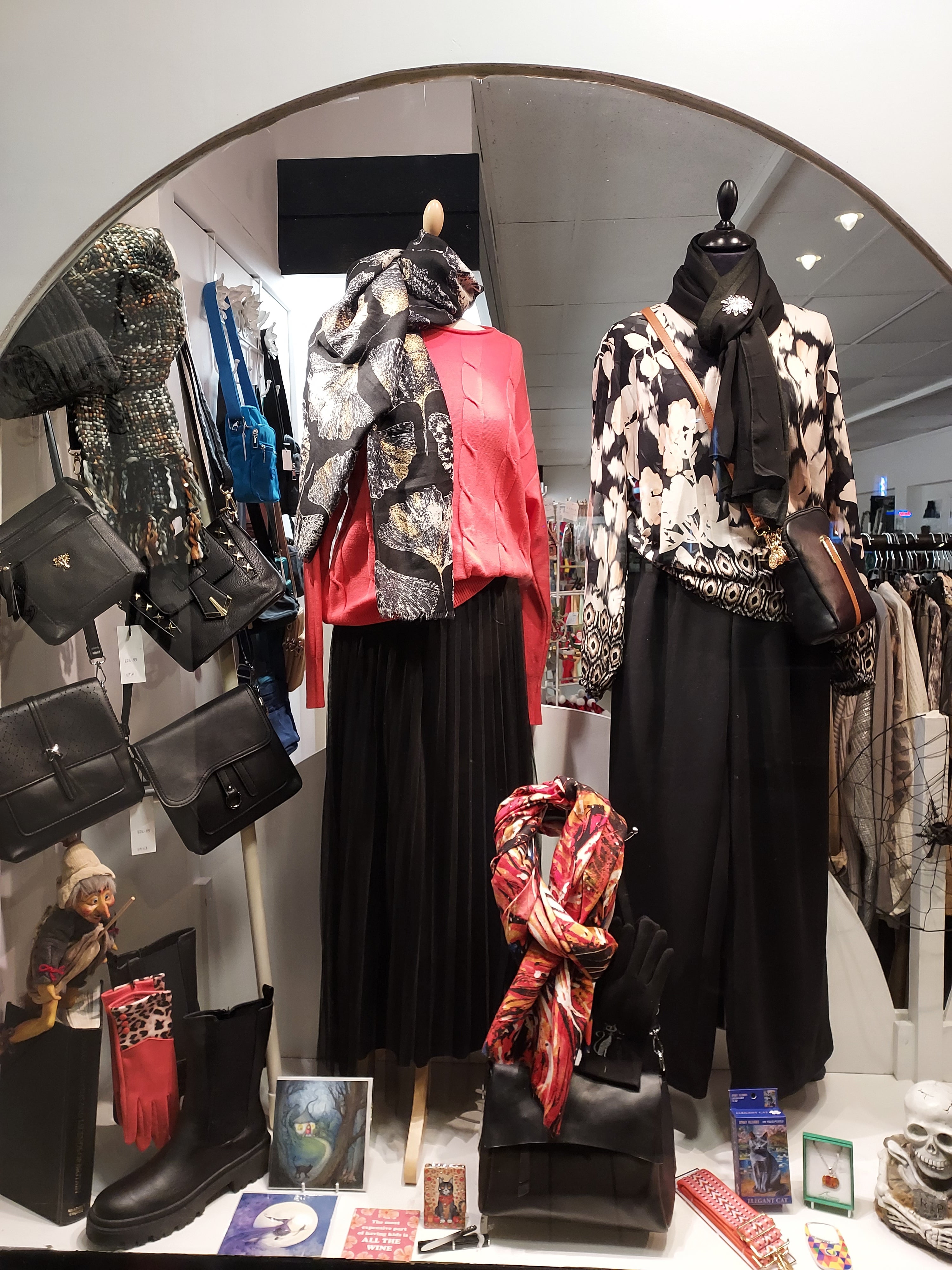 Collection of clothing and accesories in a fashion boutique window display
