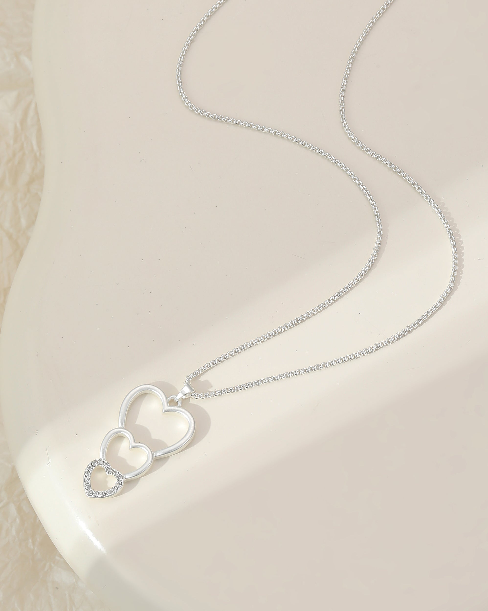 Silver Plated Triple Heart Pendant Necklace with Crystal Accents
